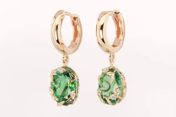 Custom rose gold drop earrings with oval green gemstones and diamond halos