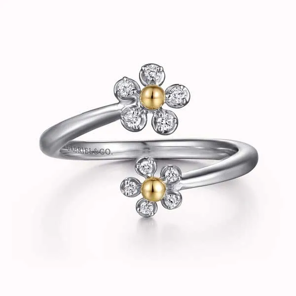 Silver ring with two diamond flower designs and gold centers. Explore gifts under $500.
