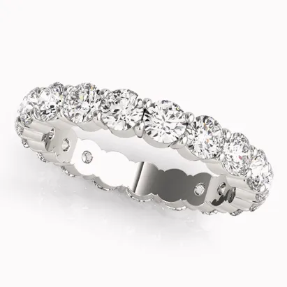 Diamond eternity band ring with a polished silver setting, showcasing a continuous line of sparkling diamonds.