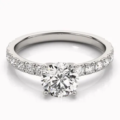 Elegant diamond engagement ring with a round center stone and a single row of smaller diamonds on the band.