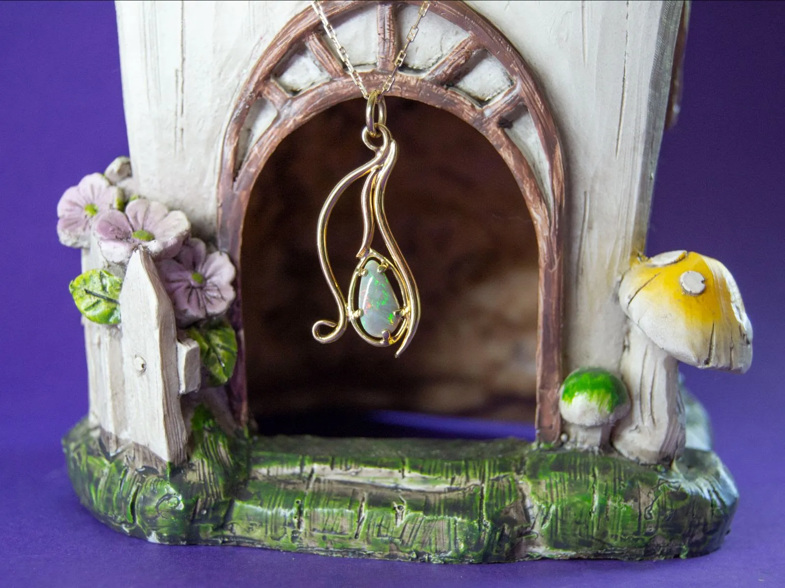 Handmade Semi-black opal pendant yellow gold swirls at The Diamond Center Claremont, CA