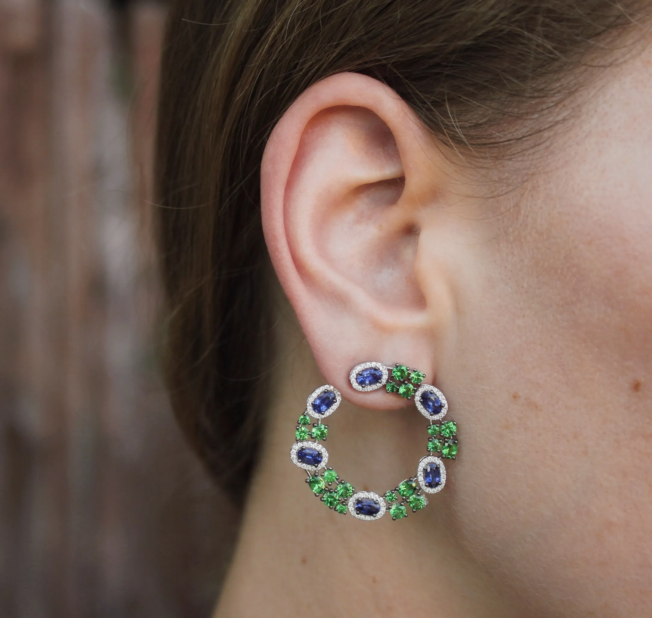 Sapphire, Tsavorite Garnet and Diamond Earrings Glamorous Robert Procop earrings showcase brilliant blue sapphires and lush green garnets. The colors of these fabulous natural gemstones harmonize beautifully. The Diamond Center Claremont, CA