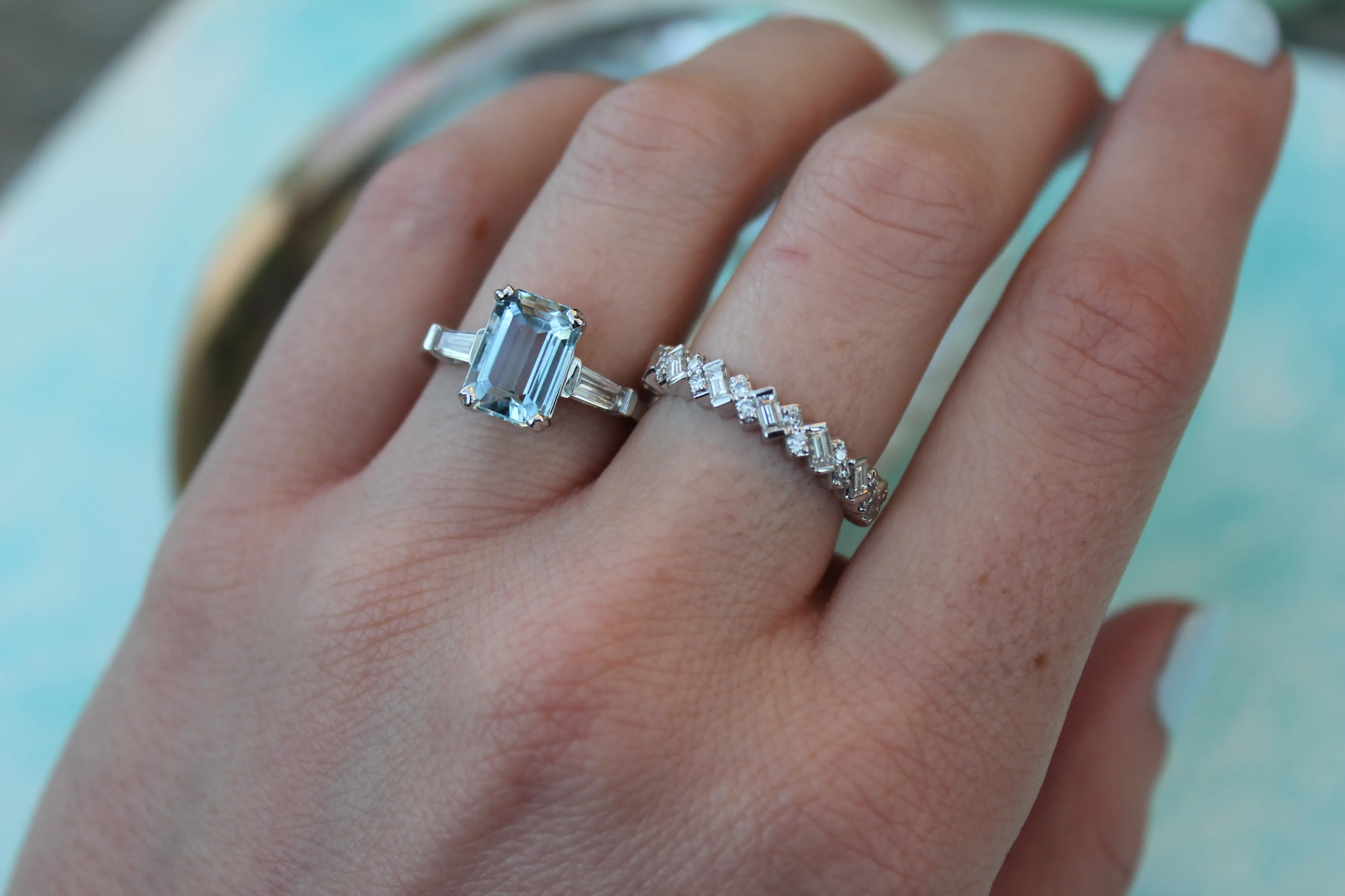 Aquamarine Ring Paired with a Diamond Band march birthstone diamond baguettes The Diamond Center Claremont, CA