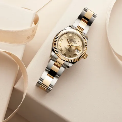 Luxury two-tone Rolex watch with gold dial displayed by LeeBrant Jewelry & Watch Co.