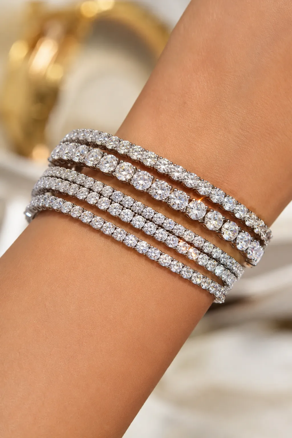 Elegant diamond tennis bracelets on red satin background.