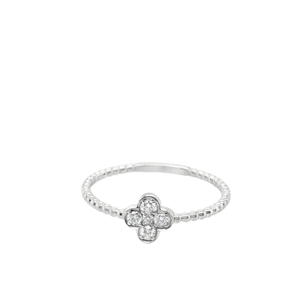 Gold clover-shaped ring with a central diamond. Explore fashion rings.