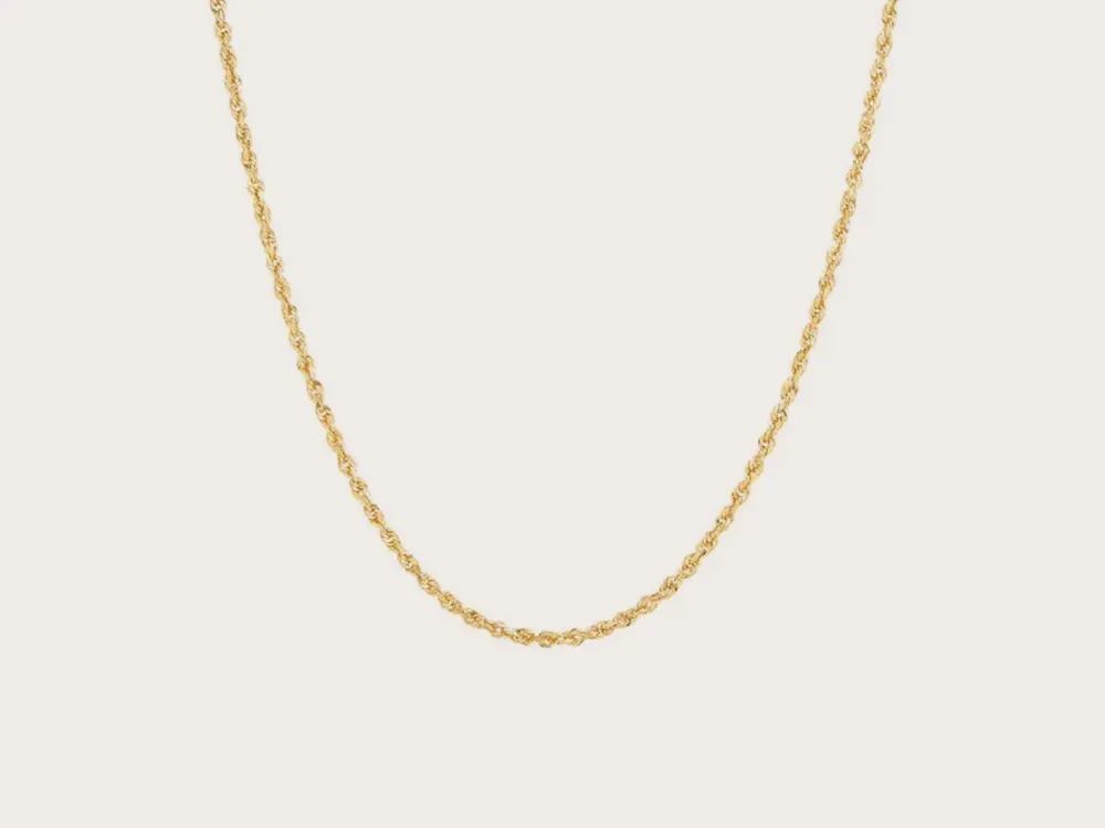 Gold rope chain necklace on a plain background. Click to explore chains.