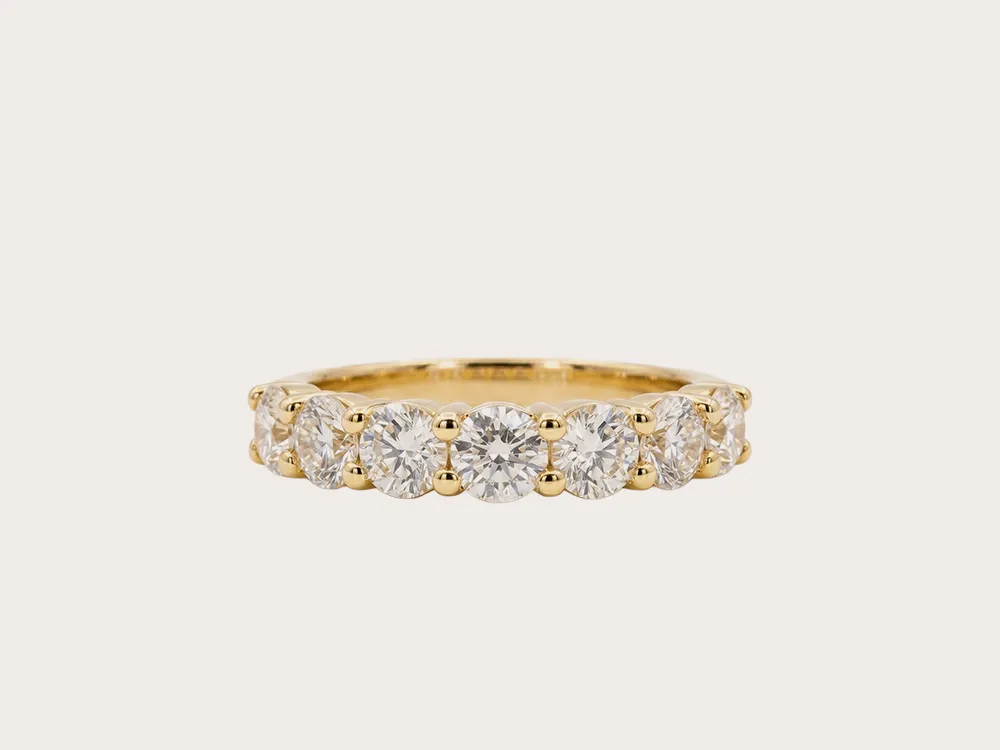Gold ring with seven round diamonds. Click to explore lab-grown options.