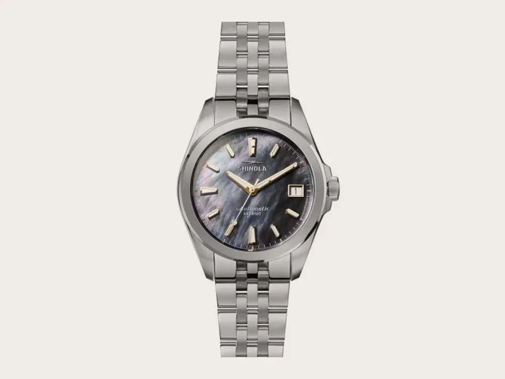 Silver watch with a dark face and date display. Click to explore more watches.