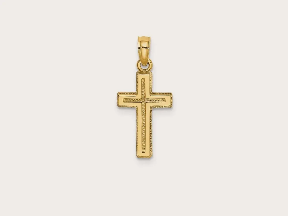 Gold cross pendant with textured edges on a white background. Click to shop charms.