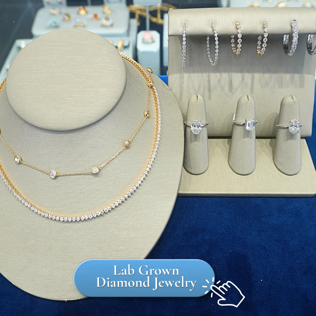 Elegant display of necklaces, rings, and earrings on a blue velvet background at Lumina Gem jewelry store.