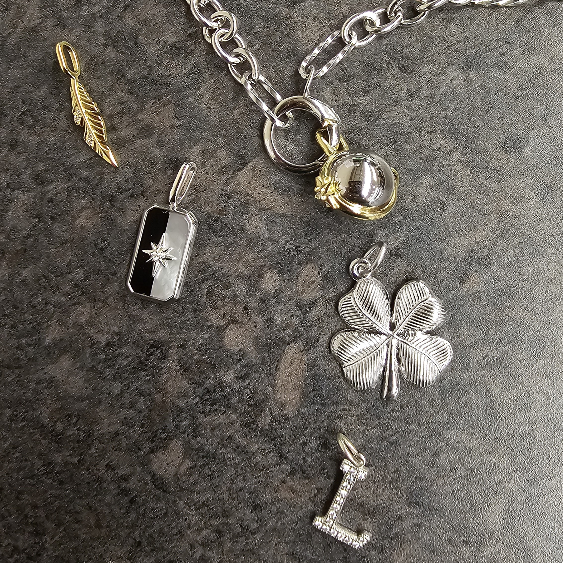 Sterling Silver, Gold-Plated, and Solid Gold Charms at Mark Jewellers in La Crosse, WI