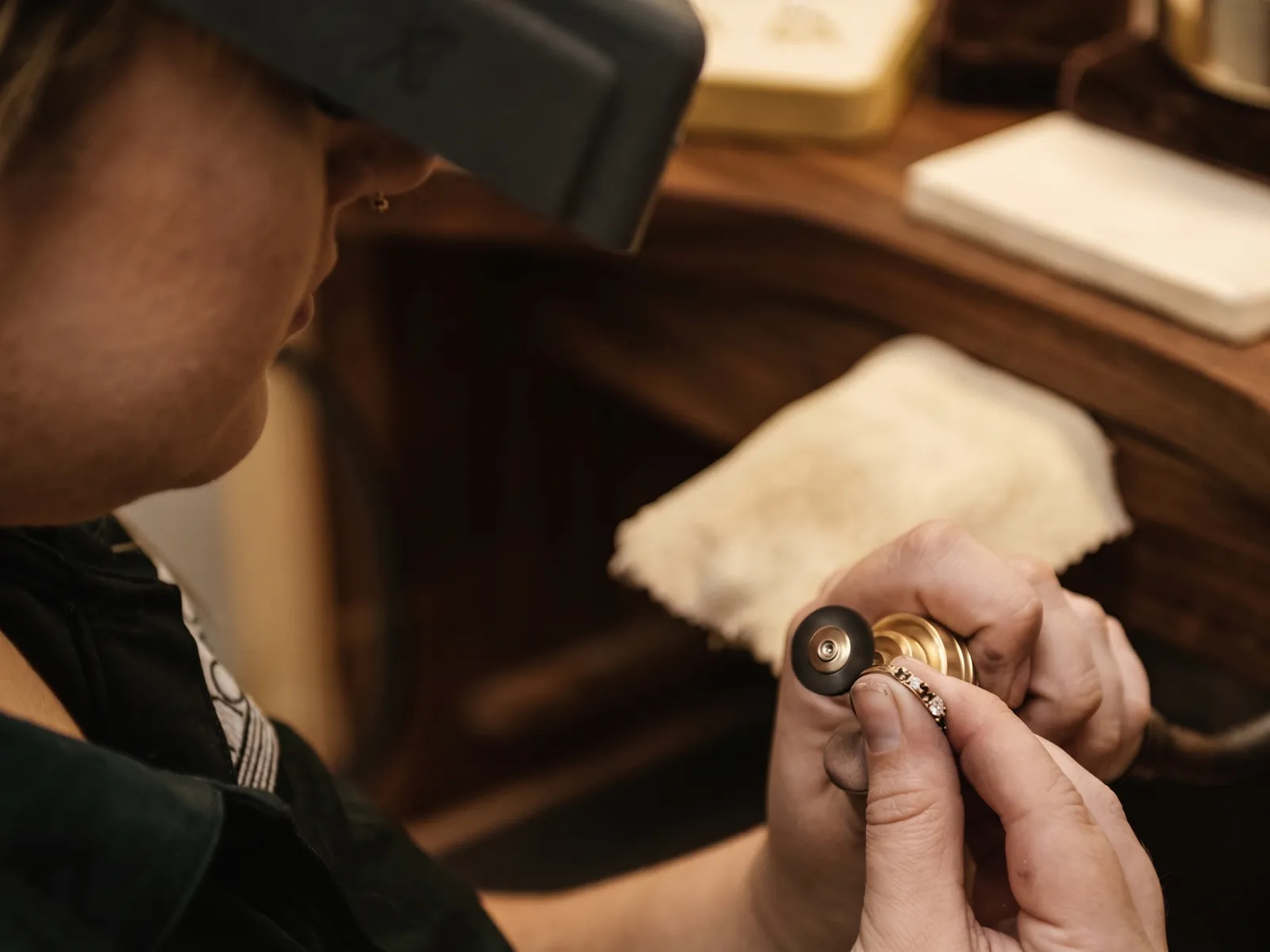 Jeweler working on a ring at a goldsmith bench in Bellingham, MA.