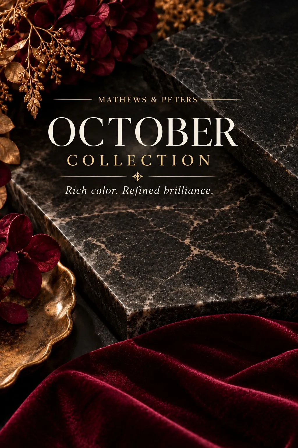 Dark marble framed by burgundy velvet, deep red flowers, and gold foliage for the Mathews & Peters October Collection.