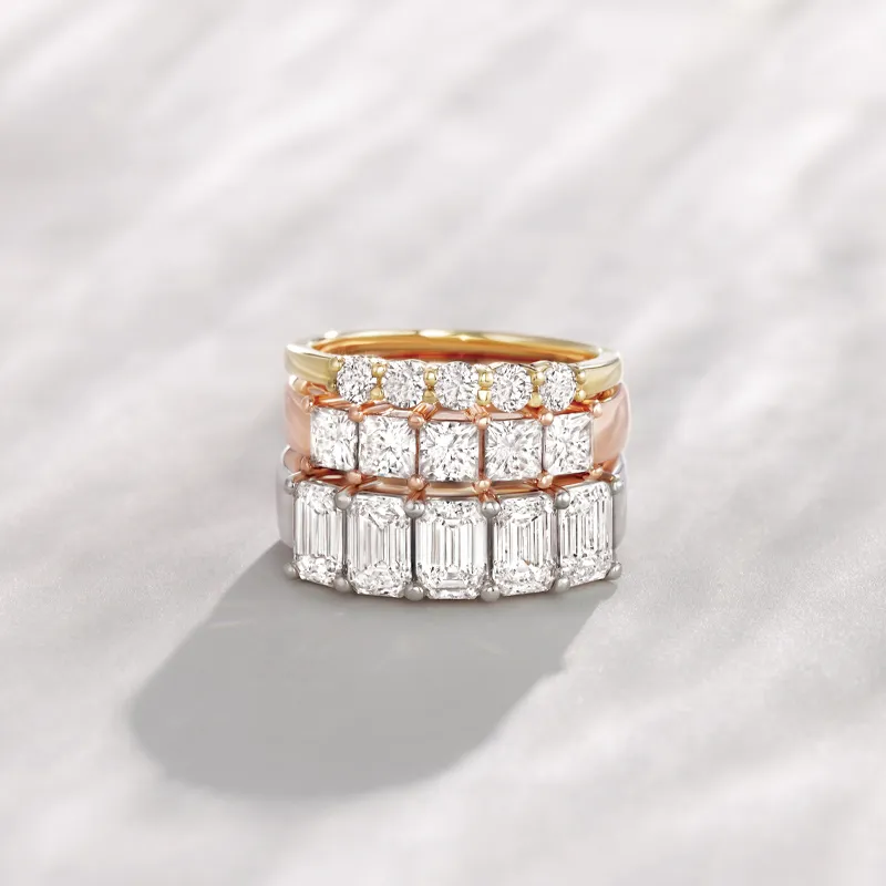 Three elegant diamond bands in yellow, rose, and white gold, showcasing lab-grown diamonds.