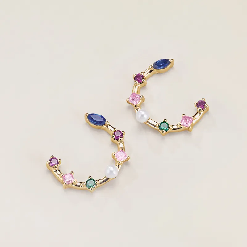 Colorful gemstone earrings with gold accents, featuring various shapes and a pearl.
