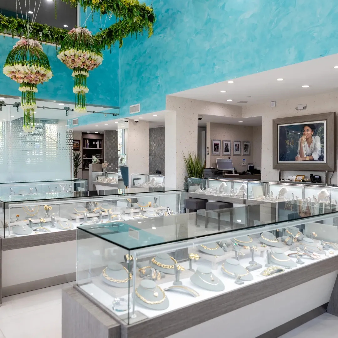 Entrance to McCarver Moser jewelry store with glass doors and display cases inside.