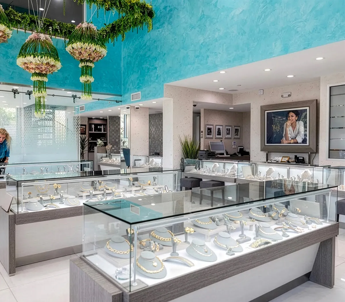 Entrance to McCarver Moser jewelry store with glass doors and display cases inside.