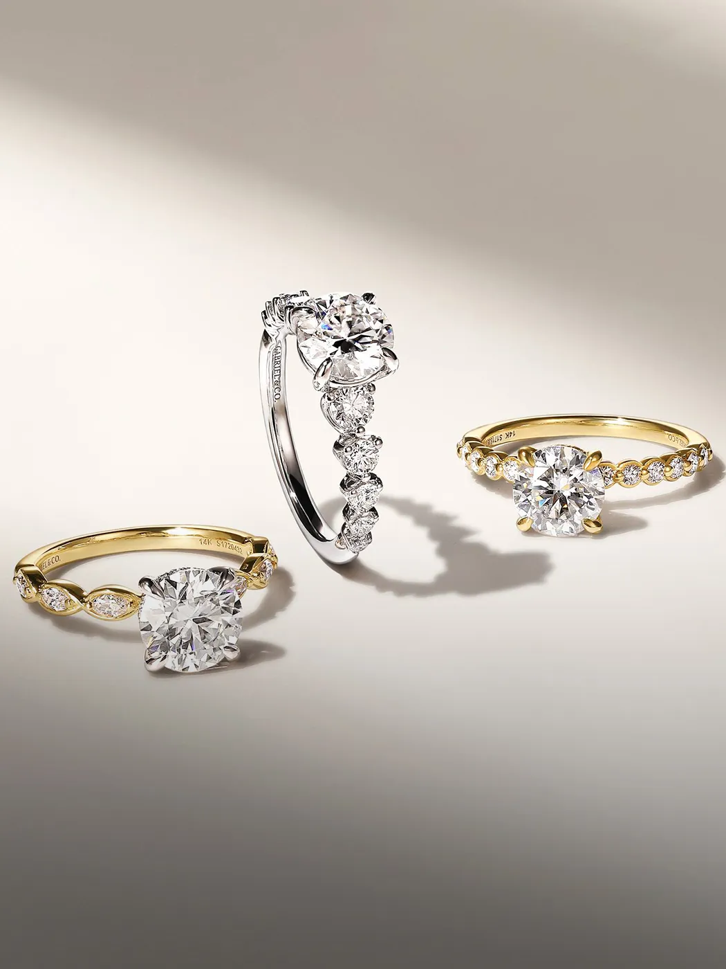 Diamond engagement rings with gold and silver bands at McGee & Company, Greenwood, Indiana. Explore engagement rings.