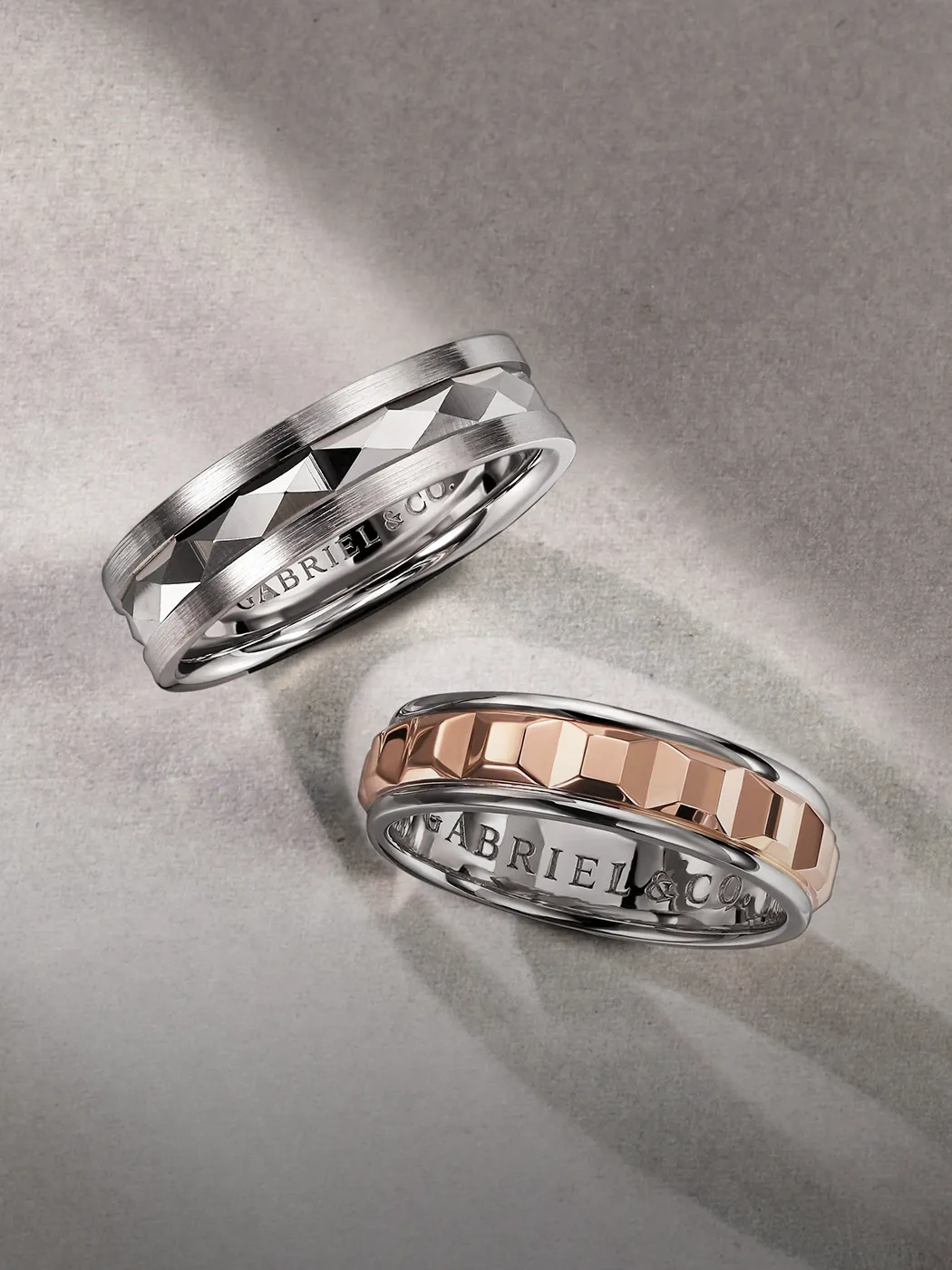 Men's wedding bands with geometric designs in silver and rose gold tones. Explore more at McGee & Company.