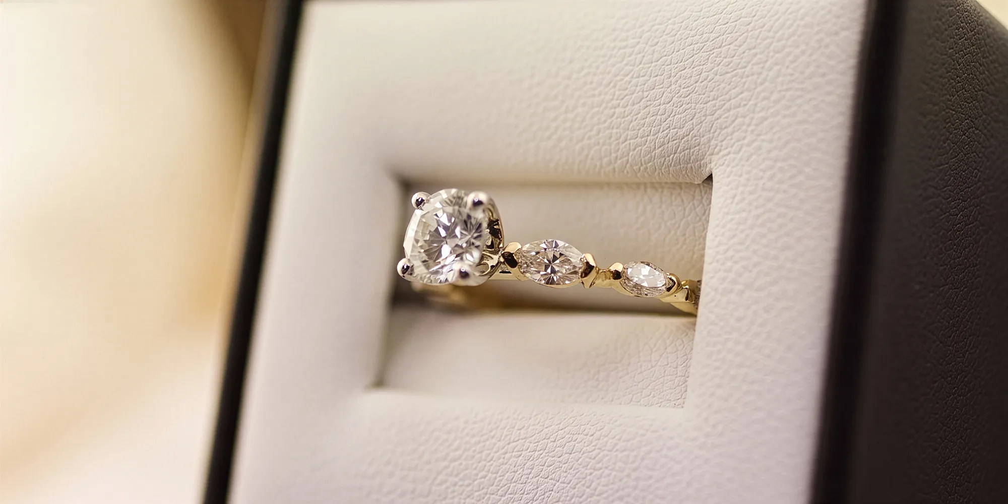 Custom engagement ring with diamonds in a jewelry box at McGee & Company Fine Jewelers, Greenwood.