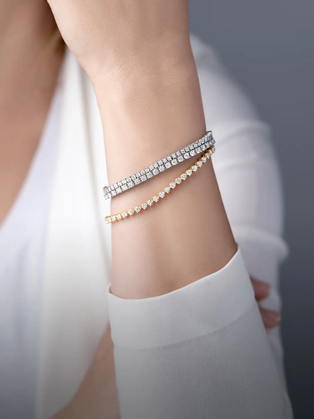 Lab-grown diamond bracelets on a wrist, showcasing elegance and style.