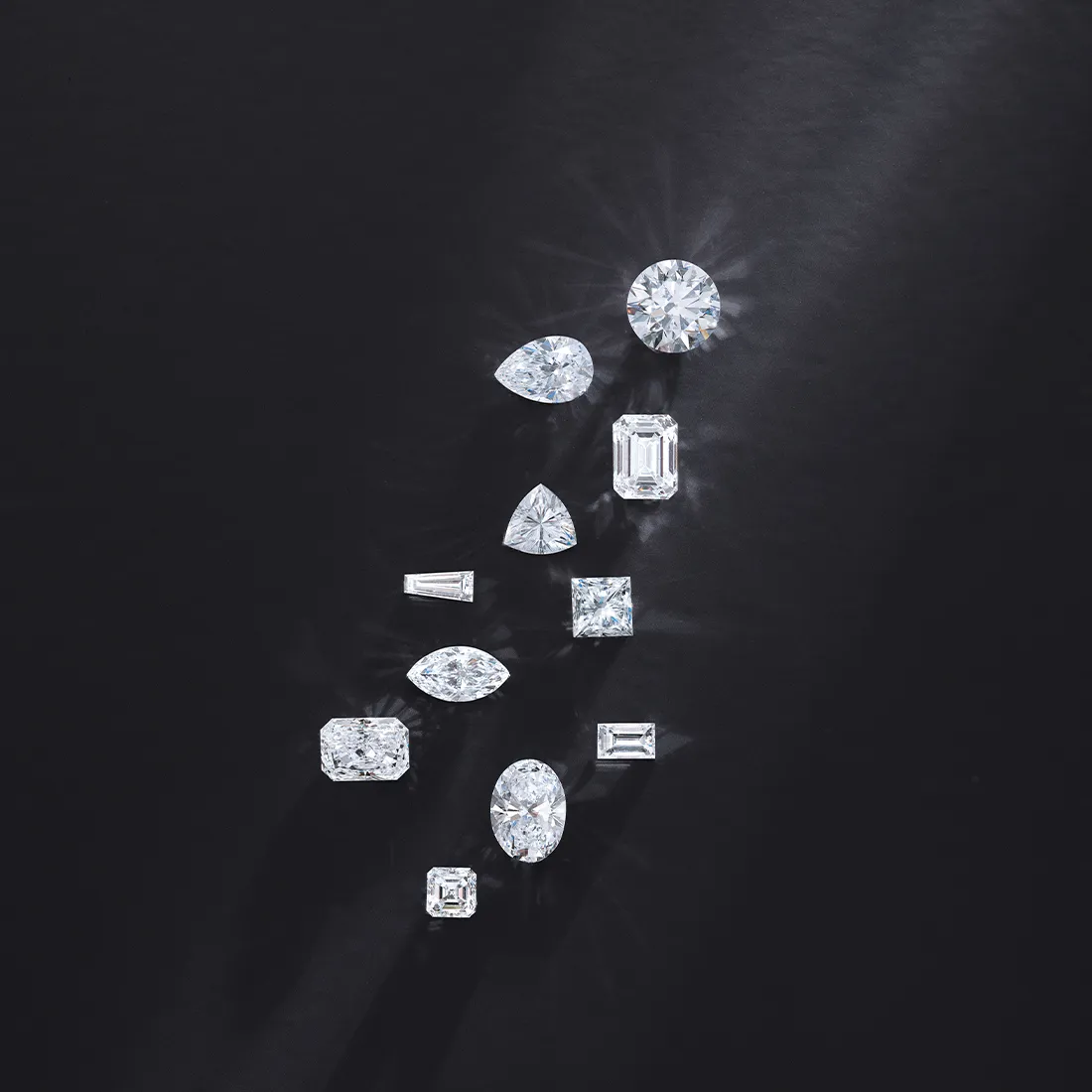 Various diamond cuts displayed on a dark background.