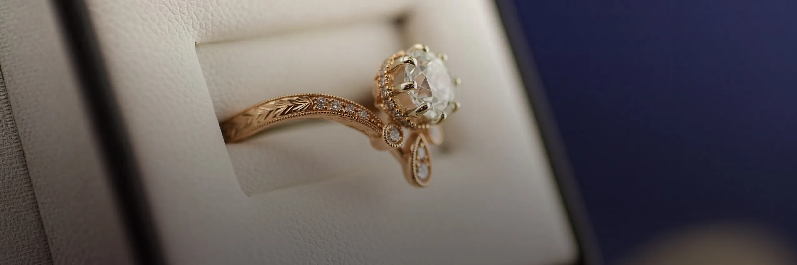 Elegant gold ring with diamond in a jewelry box. Start a Project at McGee & Company Fine Jewelers.