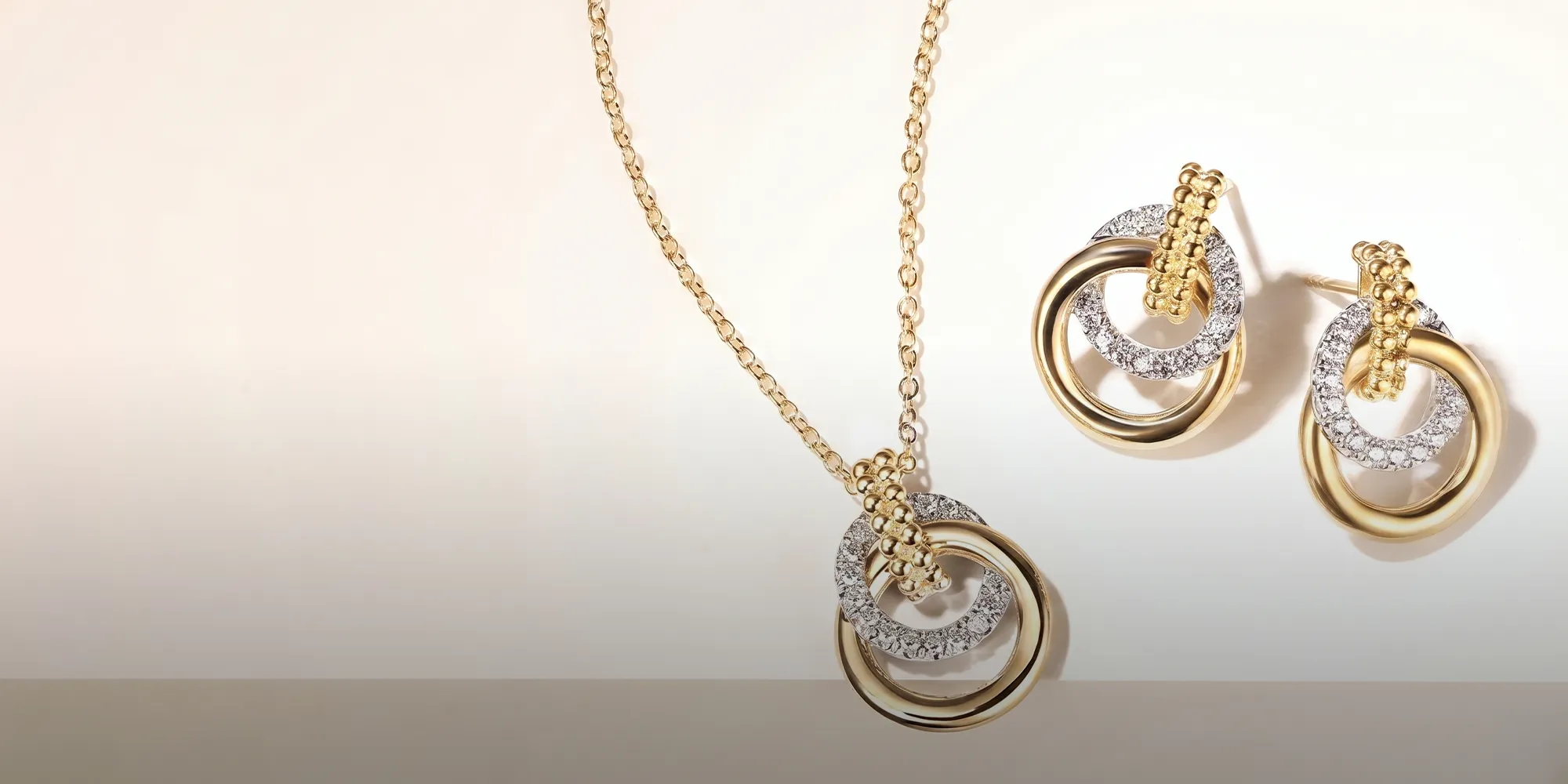 Gold and silver interlocking circle necklace and earrings set. Shop Gabriel & Co.