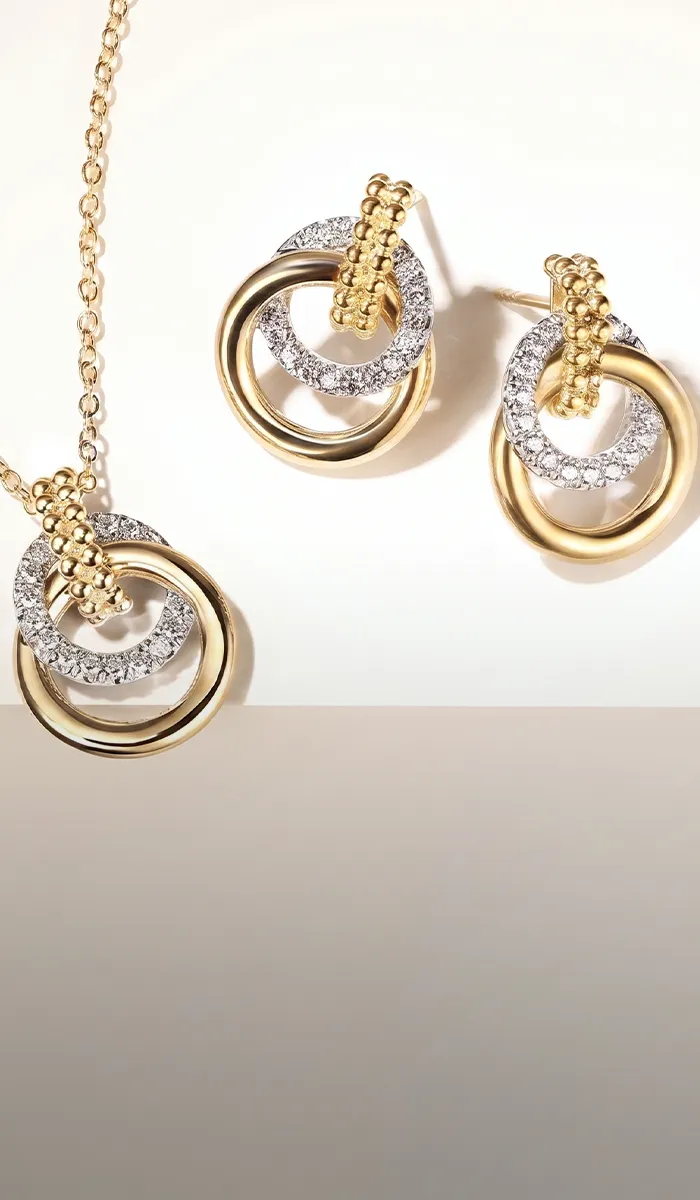 Gold and silver interlocking circle necklace and earrings set. Shop Gabriel & Co.