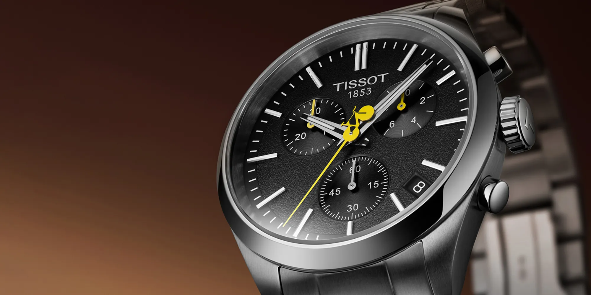 Stainless steel watch with black dial and yellow accents from Tissot.