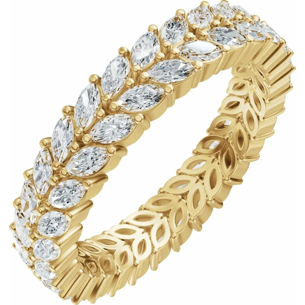 Gold women's wedding band with marquise-cut diamonds, showcasing a floral design. Click to Shop Now at Mead Jewelers.