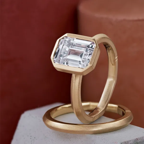 emerald cut diamond ring with gold band