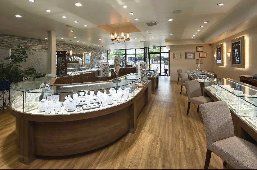 Elegant jewelry store interior with display cases and seating. Visit Mesa Jewelers in Grand Junction for fine jewelry.