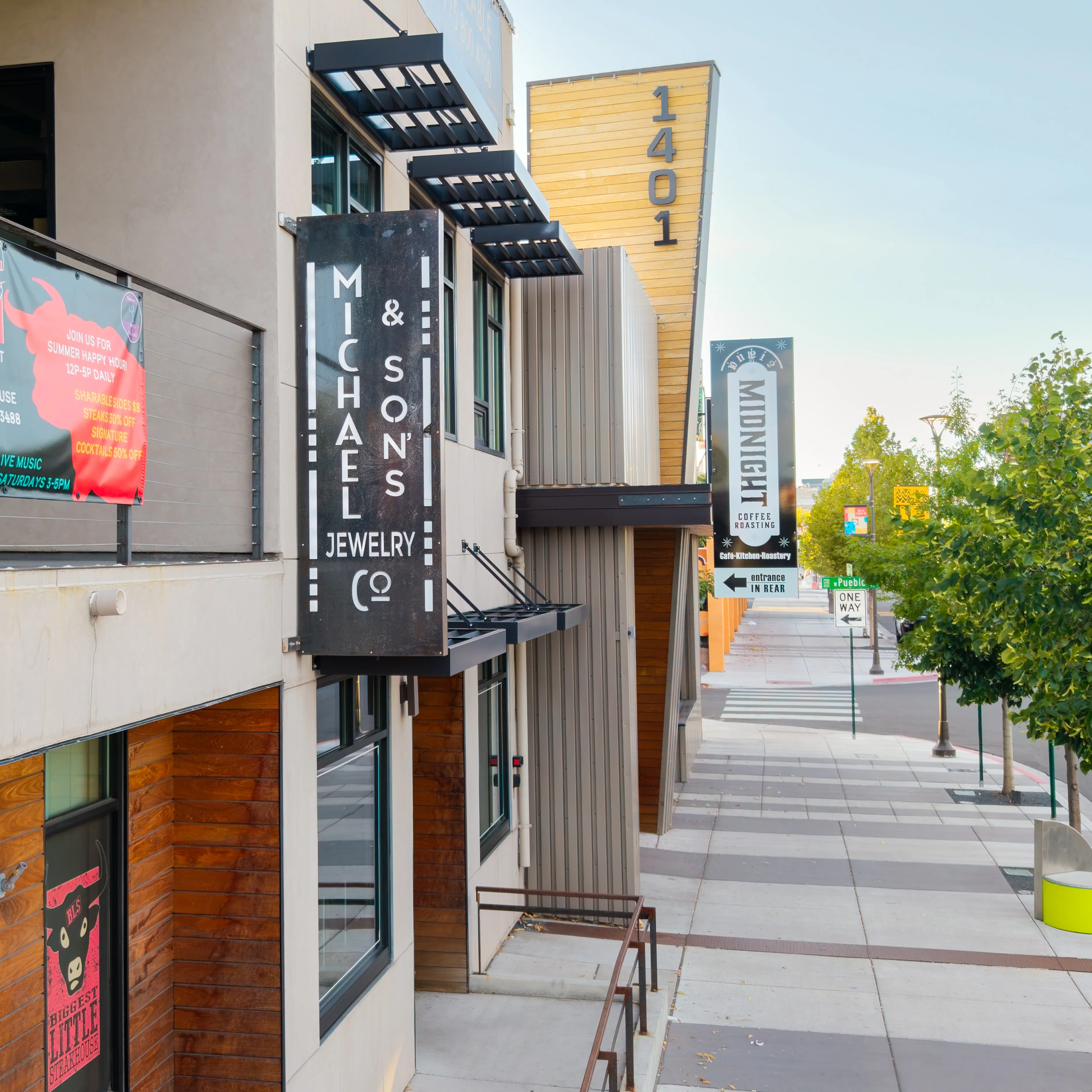 Elegant diamond engagement ring by Noam Carver on a colorful background.