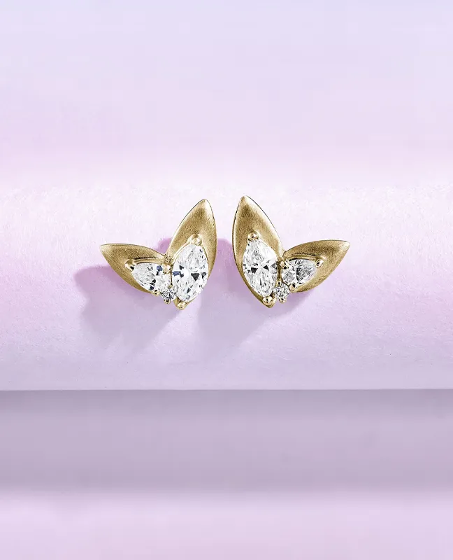 Gold pointed earrings with sparkling diamonds, perfect for elegant occasions.