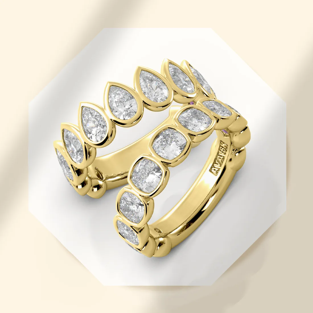 Gold rings with pear-shaped diamonds, elegantly stacked, showcasing fine jewelry.