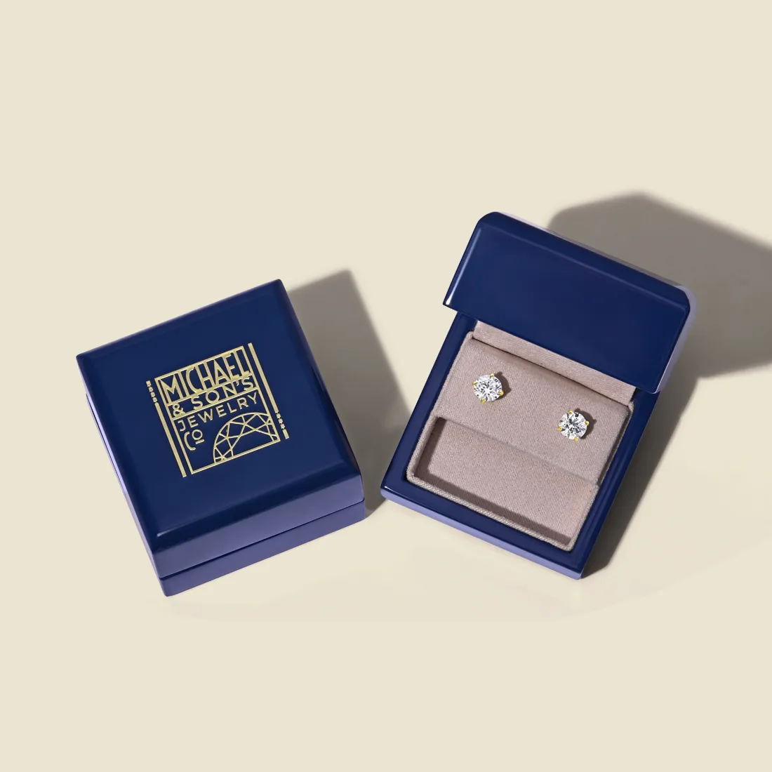 Diamond stud earrings in a navy blue box from Michael & Son's Jewelers, Reno's destination for fine jewelry.