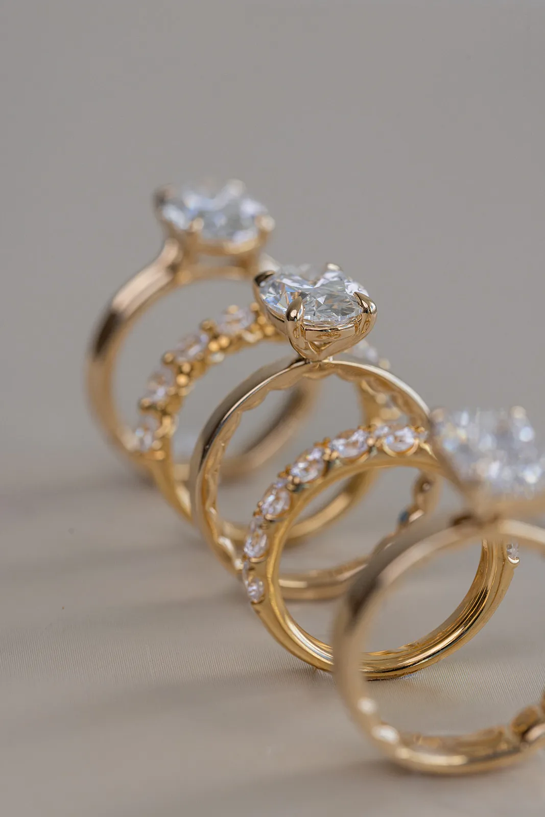 Yellow gold diamond solitaire rings with diamond wedding bands