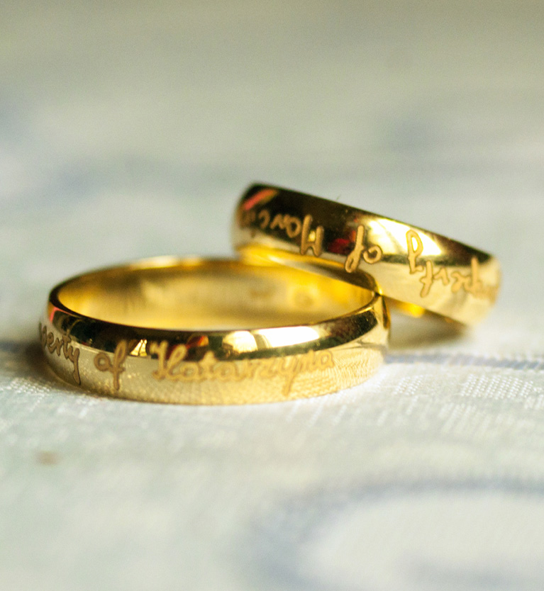 Matching gold wedding bands with engraving