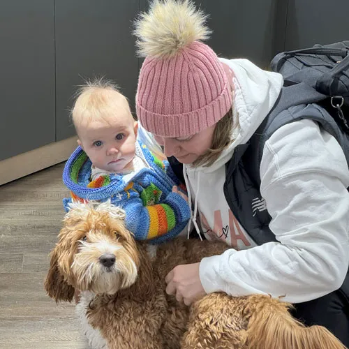 Milo with a young visitor at Midtown Jewelers