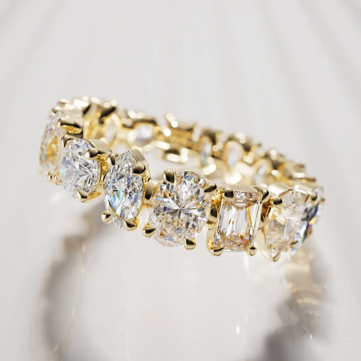 Elegant gold wedding band with large, sparkling diamonds. Shop wedding bands at Midtown Jewelers in Herndon, VA.
