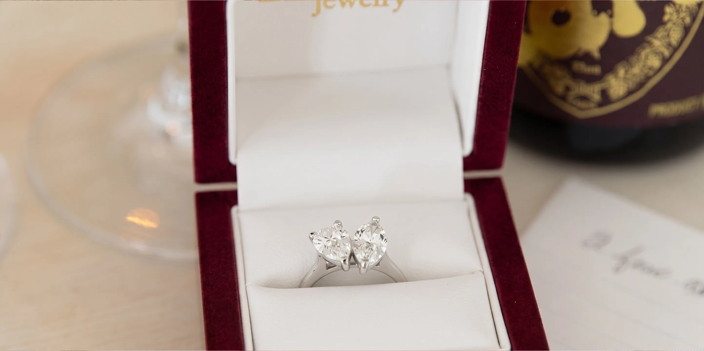 Elegant diamond ring in a wooden box from Mitchell's Jewelry, Norman.