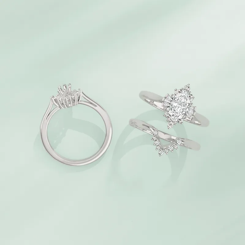 Three elegant silver rings featuring diamonds, displayed on a soft mint background. Visit Monarch Jewelry for more.