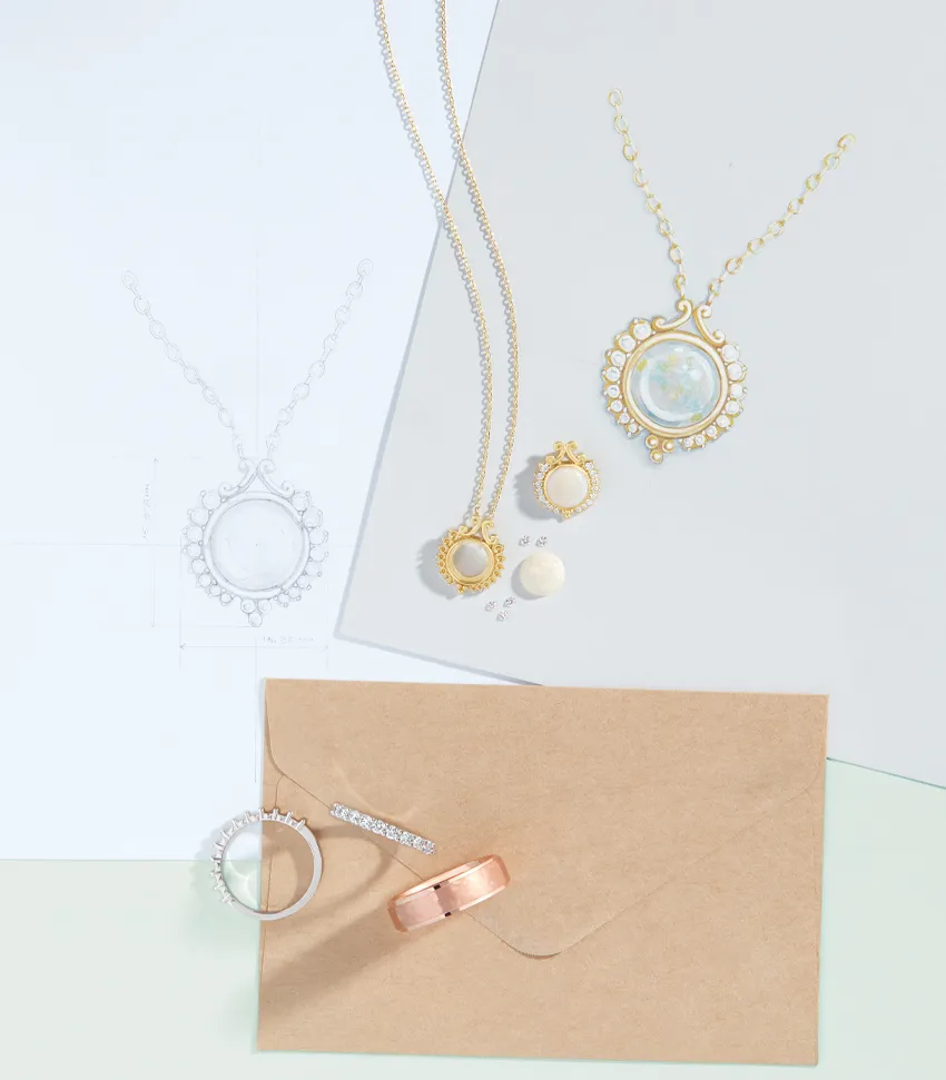 Elegant jewelry display featuring necklaces, rings, and earrings on a light background. Visit Monarch Jewelry in Winter Park.