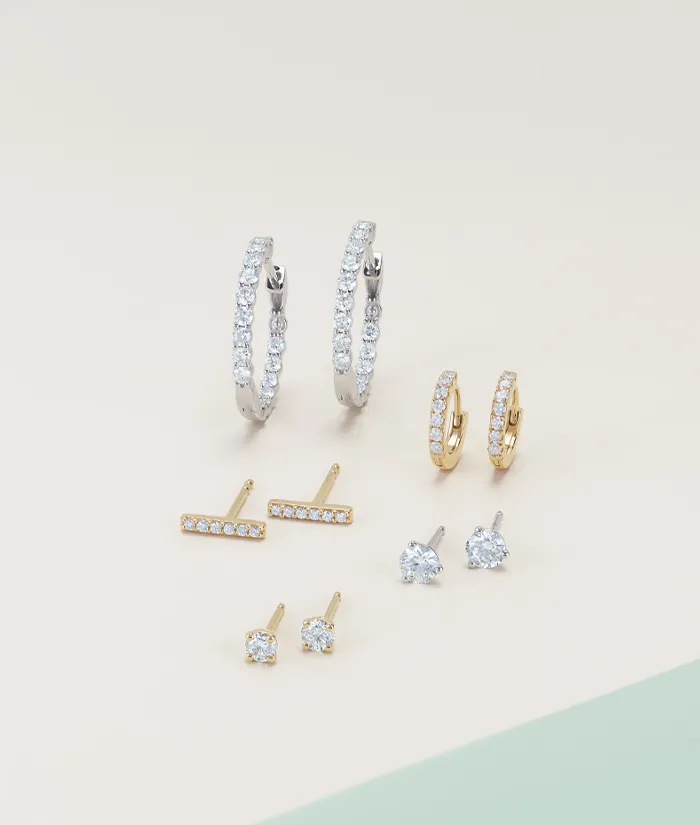Stylish collection of gold and silver earrings, including hoops and studs. Click to shop designer jewelry at Monarch Jewelry.
