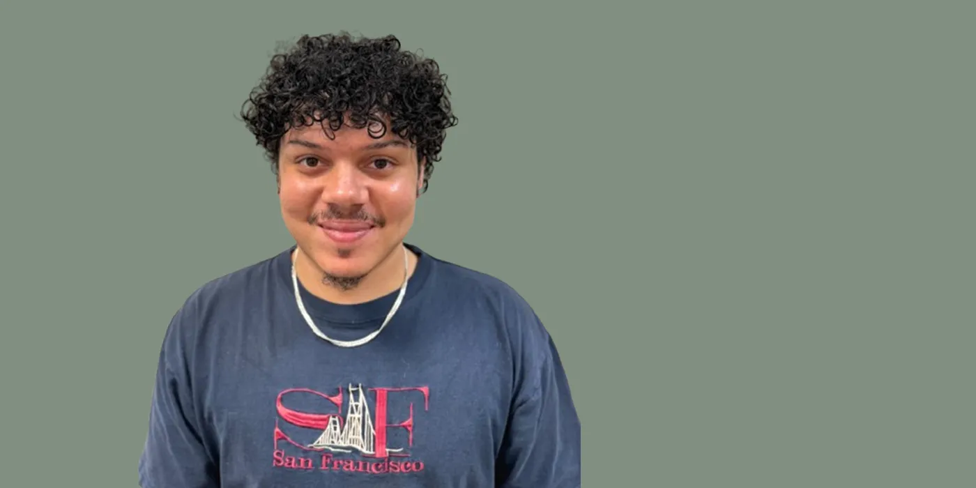 Headshot of Ismar Lorenzo on a green background