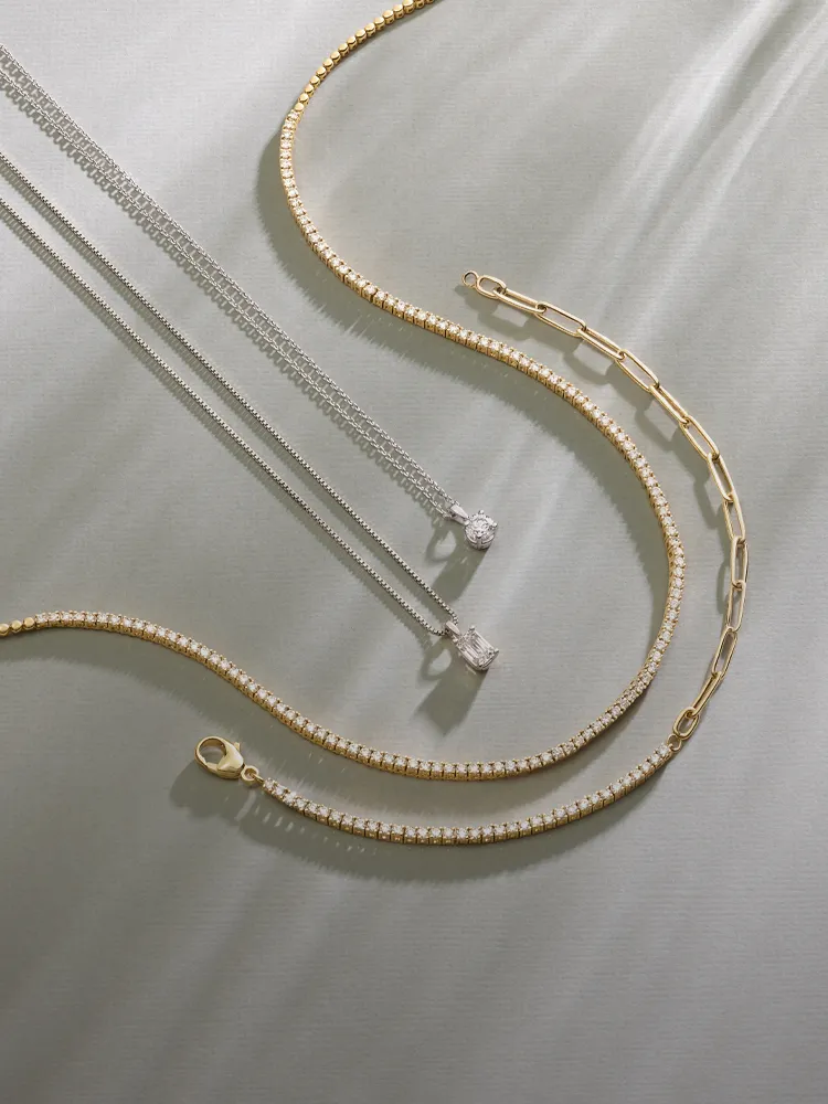 Elegant necklaces in silver and gold, featuring sparkling details. Shop Necklaces at Monarch Jewelry, Winter Park.