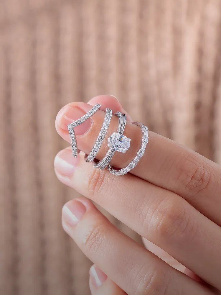 Stylish men's jewelry featuring gold chain, ring with green stone, and pendant necklace. Shop at Monarch Jewelry, Winter Park.