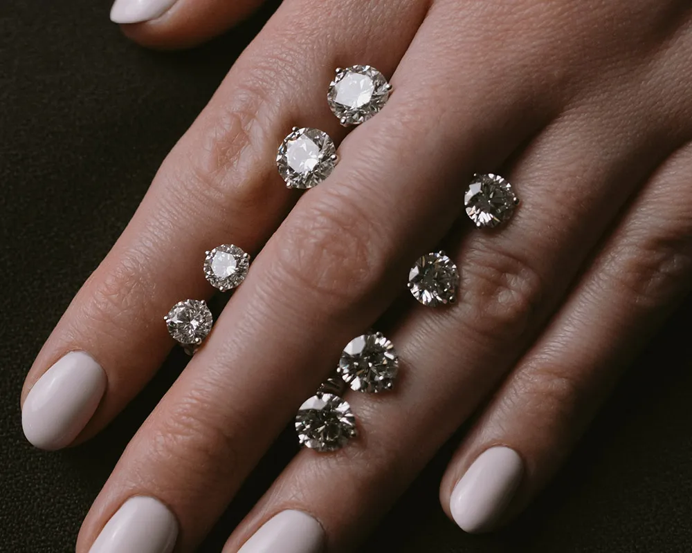 Diamond Studs A timeless first fine jewelry piece: understated, versatile, and always appropriate. This round cut set and this Princess cut set are popular with our clients.  Moore Jewelers Laredo, TX